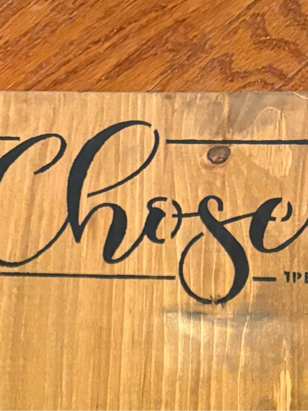 Hand-Painted wooden sign featuring a country church and the word “Chosen”